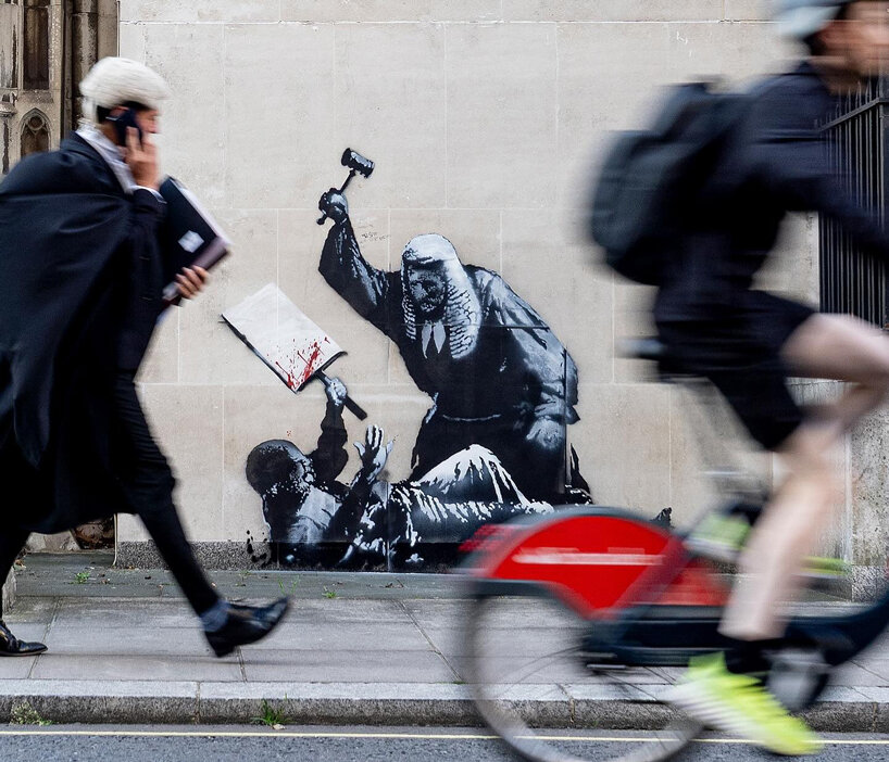 banksy is back: new stencil artwork appears at the royal courts of justice in london