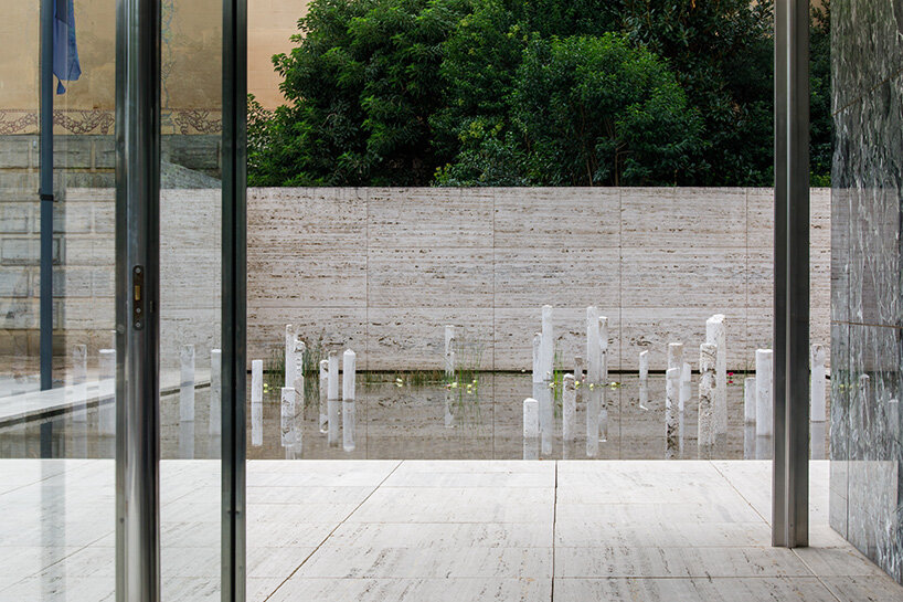 during the performance, the artists wear camouflage clothing that blends them into the Pavilion’s geometry