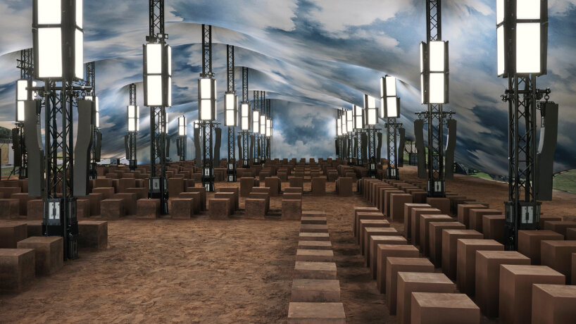 earth-covered floor and cube-shaped seats stage Burberry’s Summer 2026 show in London