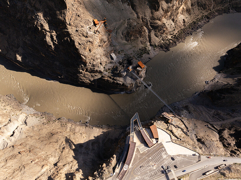 workers were secured by ropes as they chipped away rock 25 meters deep