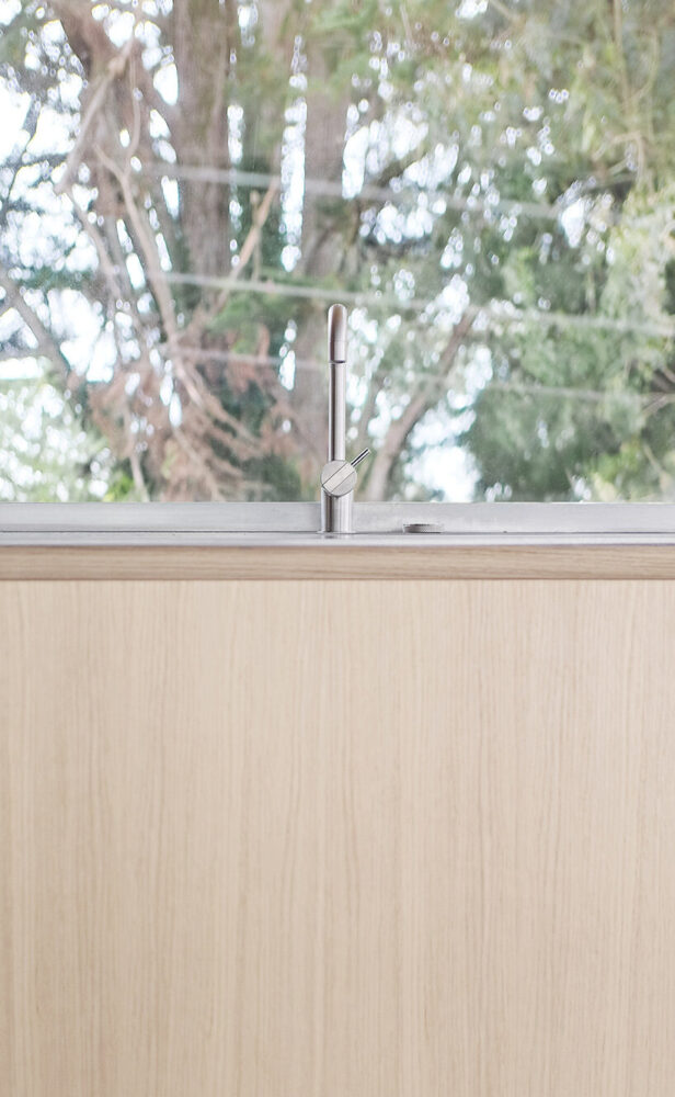 the interior’s rawness contrasts with the luminous reflections 