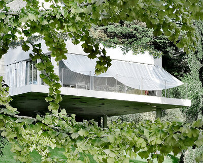 sliding curtains veil ecological cork-clad residence by mesure studio in brittany, france