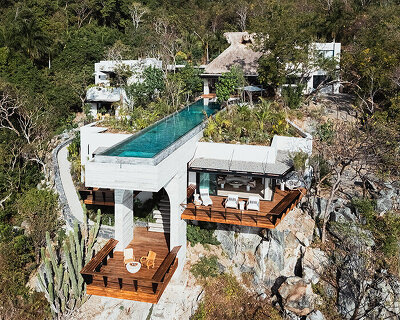 zozaya arquitectos designs home with swimming pool suspended over mexico's pacific coast