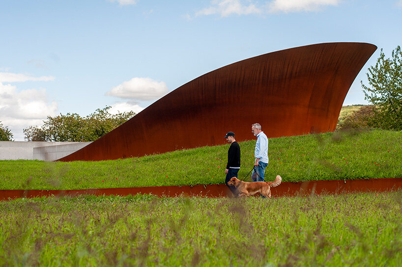 through time, its surface will weather to a natural patina through controlled corrosion | image by Marek Iwicki