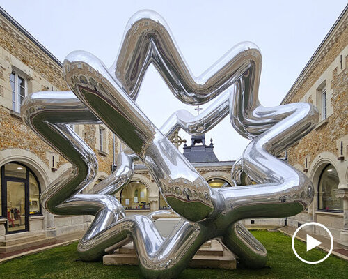 cyril lancelin’s inflatable sculpture of star loops reflects the courtyard of étrépagny library