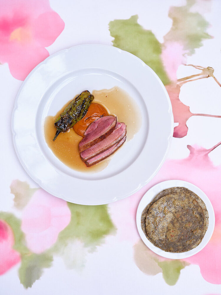 from architecture to table settings, staff aprons, and rose-themed surprises, everything was set with India Mahdavi