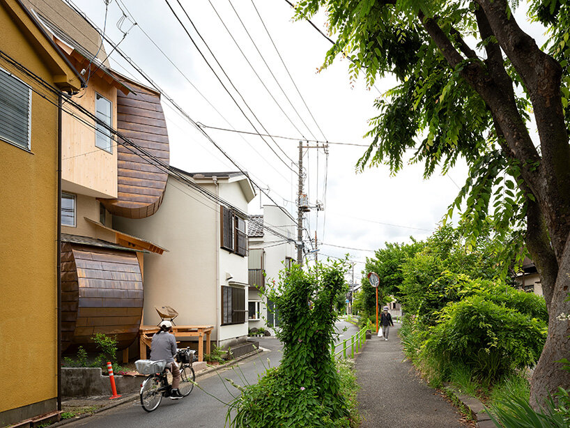 the residence sits along a lush greenway in Tokyo’s Nerima Ward