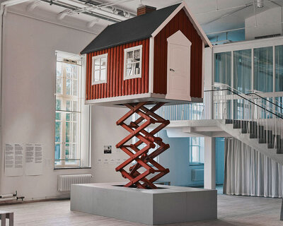 ulf mejergren builds mobile red cottage on scissor lift as a response to climate change