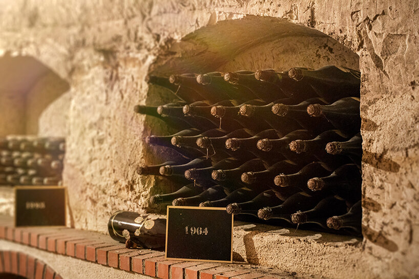 thousands of bottles in various stages of fermentation are preserved in the cellars