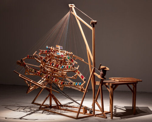 rope-making machine by conrad shawcross weaves umbilical-like cords with motorized &#8216;arms&#8217;