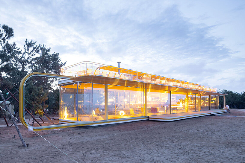 viewed from the beach, the café nearly disappears