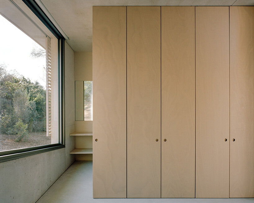 storage spaces are fronted with wooden doors