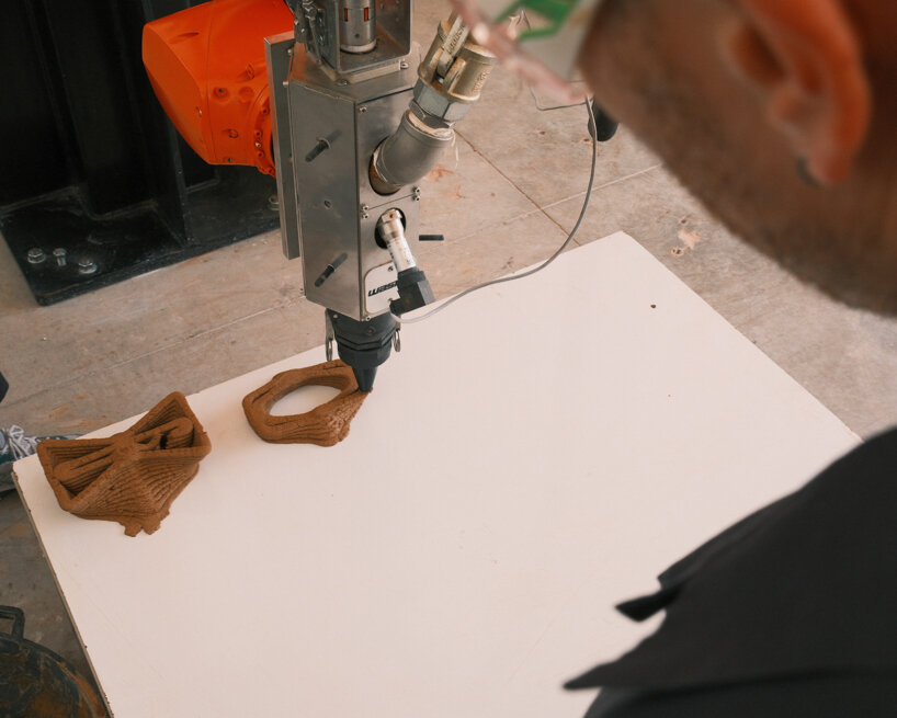 a KUKA robotic arm equipped with a WASP LDM extruder fabricates the first TreeSoil modules layer by layer from the prepared earthen mixture