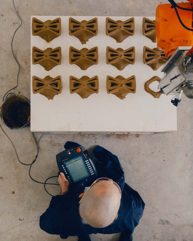 a series of modular earthen units produced through robotic extrusion at the Technion's Advanced Construction Center (TACC), demonstrating geometric precision and repeatability