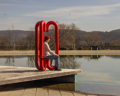 three-legged installation turns industrial gas pipes into intimate public shelter