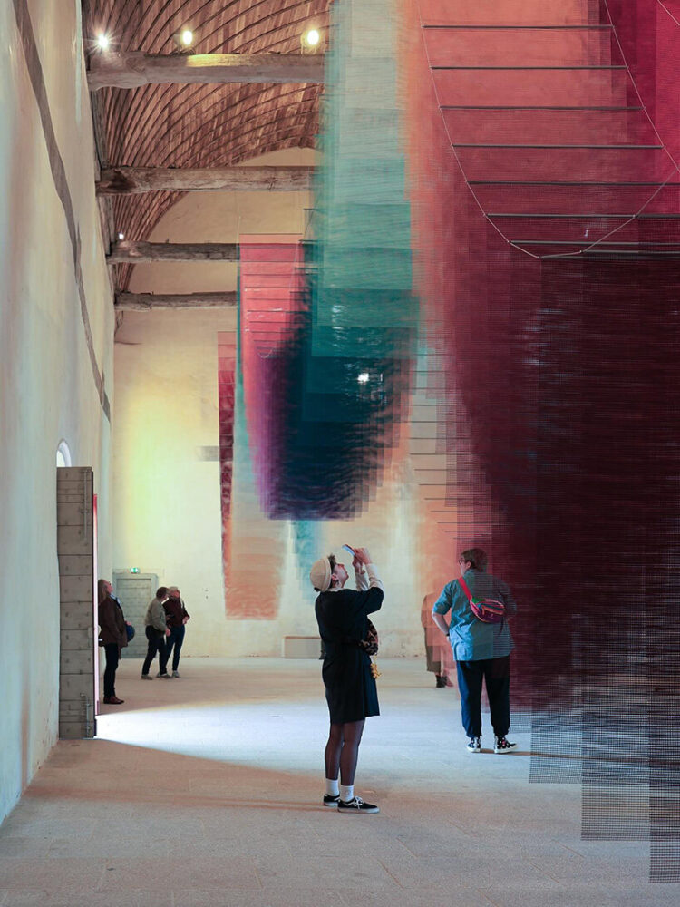 viewers move beneath the installation | image by @krnschwtz.studio via @topic_tomislav