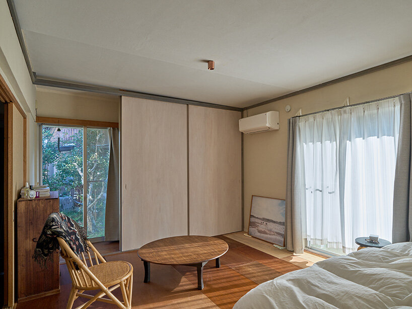 sunlight enters the bedroom through large openings