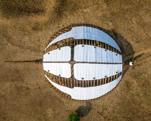 arching timber shell installation by cheng tsung feng evokes the horseshoe crab in taiwan