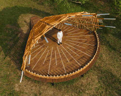 interwoven bamboo poles fan outward to form theater stage by cheng tsung feng