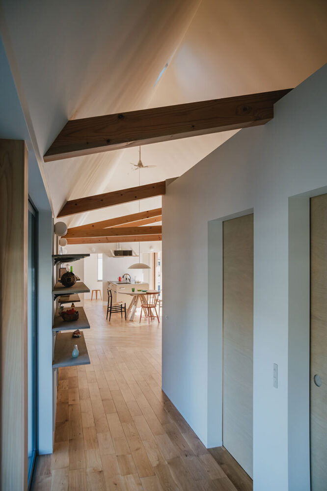 a contrast of robust timber beams against the sharp white ceiling