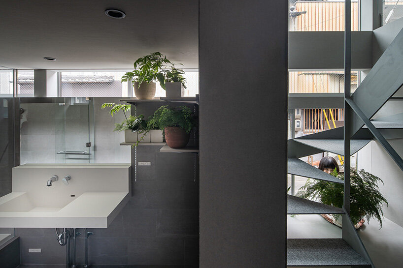 the first-floor approach is paved in the same asphalt as the road