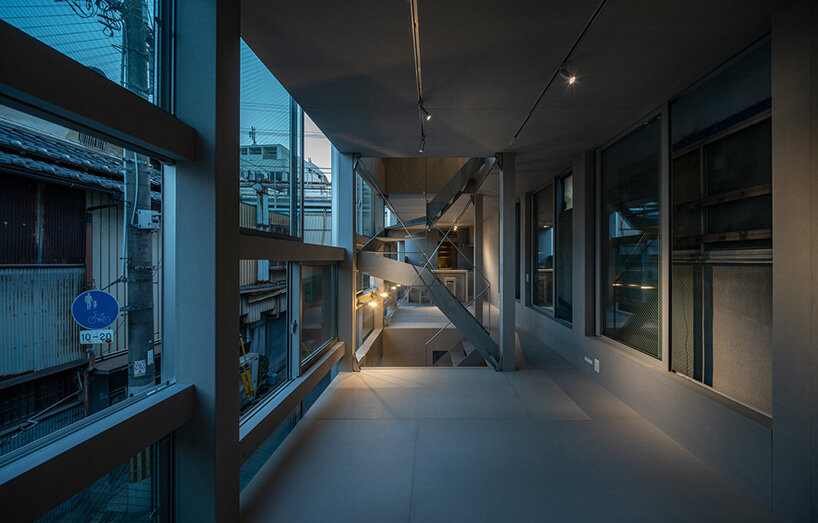 an open steel staircase links the two floors