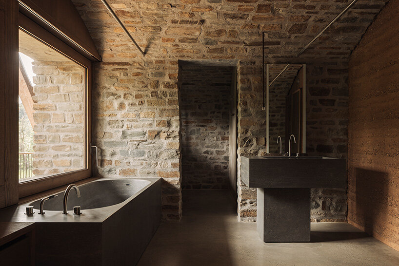 interiors are finished with rammed earth and clay plasters
