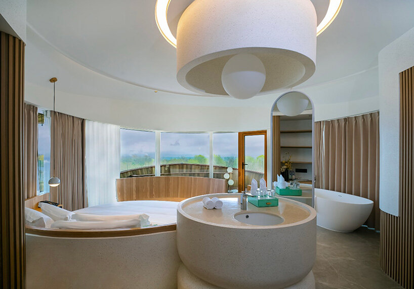 drawing natural light and sweeping forest or coastal views deep into the interior | image by © Xiaohaisen