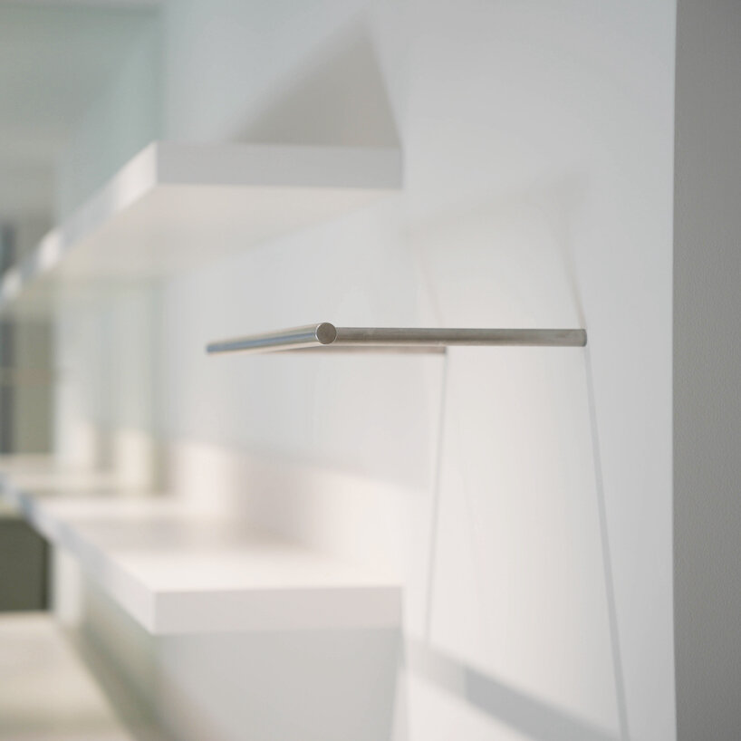 stainless-steel detailing adds subtle tension to the space