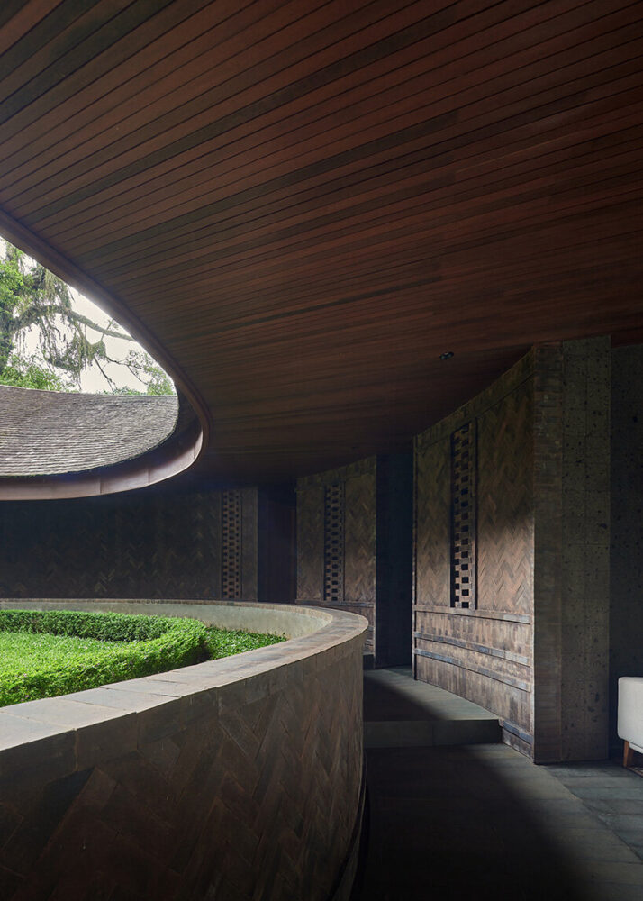 curving pathways lined with herringbone brickwork guide movement