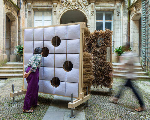 mirroring pillowed walls filled with reed grass compose sensory installation in montpellier