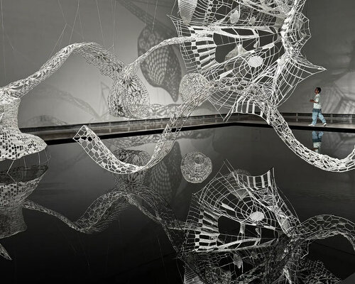 choi+shine and volunteers crochet twelve zodiac animals in one suspended lace installation