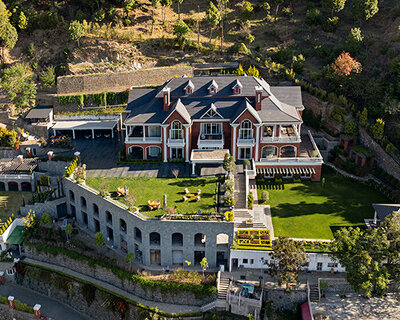 stepped residence embedded into the hillside maximizes views and privacy in india