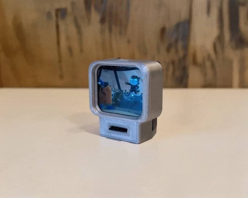 the miniature device can play videos using the SD card