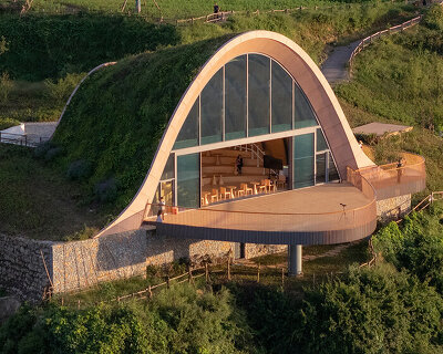 MVRDV perches arched, earth-covered timber pavilion among the hills of chengdu, china