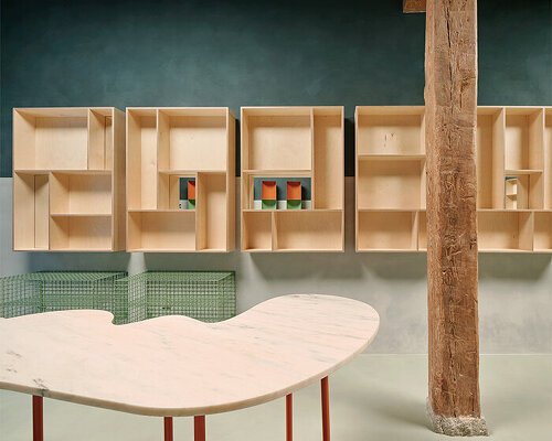 organic marble tables and vibrant hues complete madrid store by lucas y hernández-gil