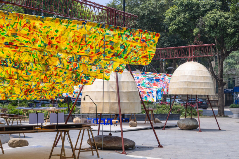 there are paper domes installed alongside the hanging structures