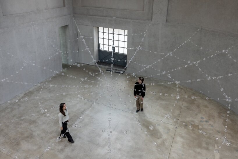 the installation comprises a series of hand-blown glass spheres