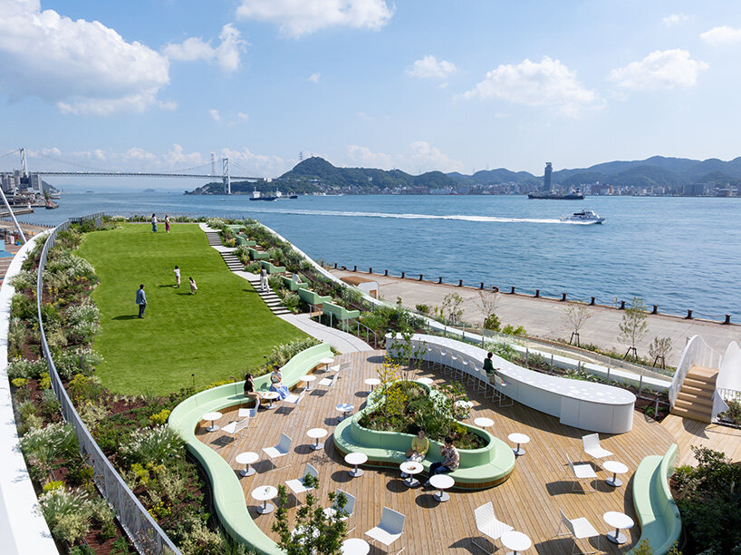 a waterfront lawn and terrace open directly onto the Kanmon Strait