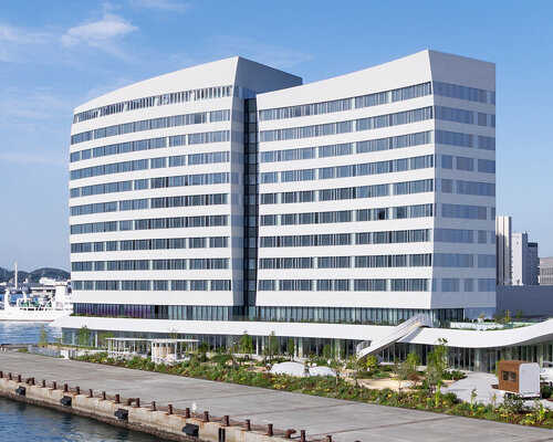 curved twin volumes shape the risonare shimonoseki hotel along japan’s kanmon strait