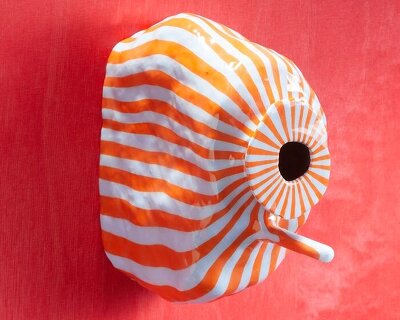 over 75 birdhouse designs explore the concept of home at MAD brussels exhibition