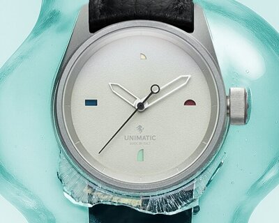 tiny multicolor windows mark the hours on luca nichetto’s watch with UNIMATIC
