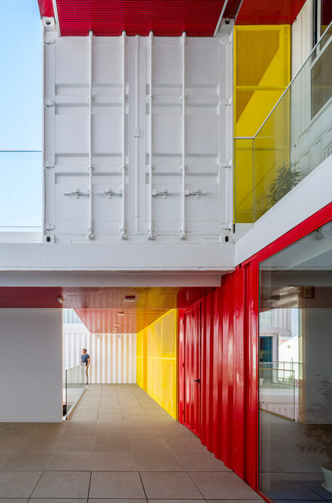 exposed container doors and structural details remain visible within circulation areas