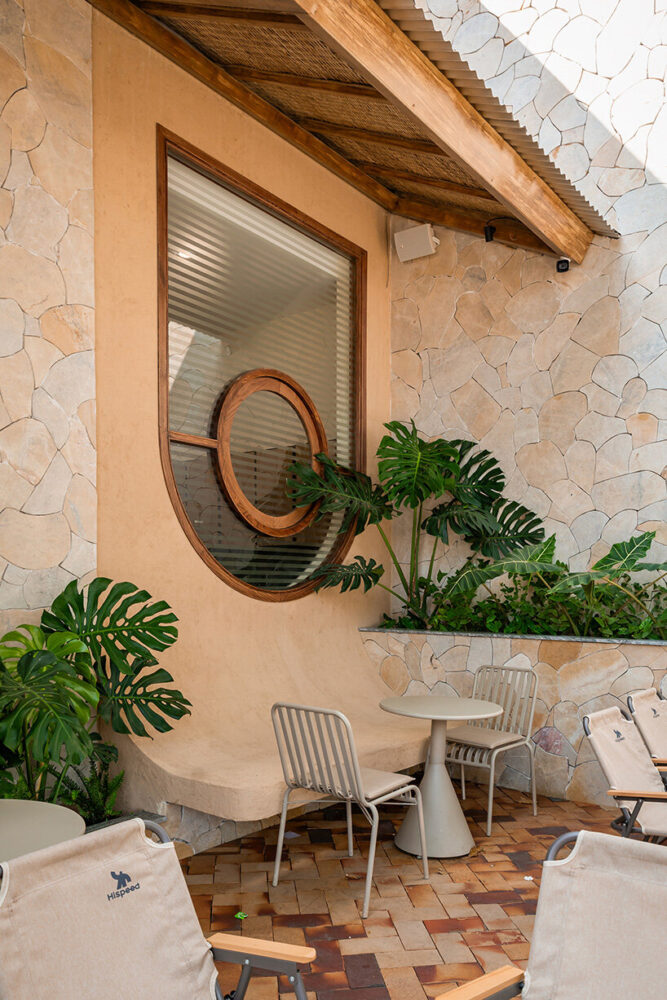 woven reed panels line the underside of the roof