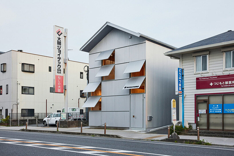 the narrow, gabled volume responds to the scale of the historic townhouse plot
