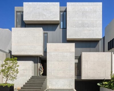 six extruded concrete volumes sculpt brutalist villa’s facade in mexico city
