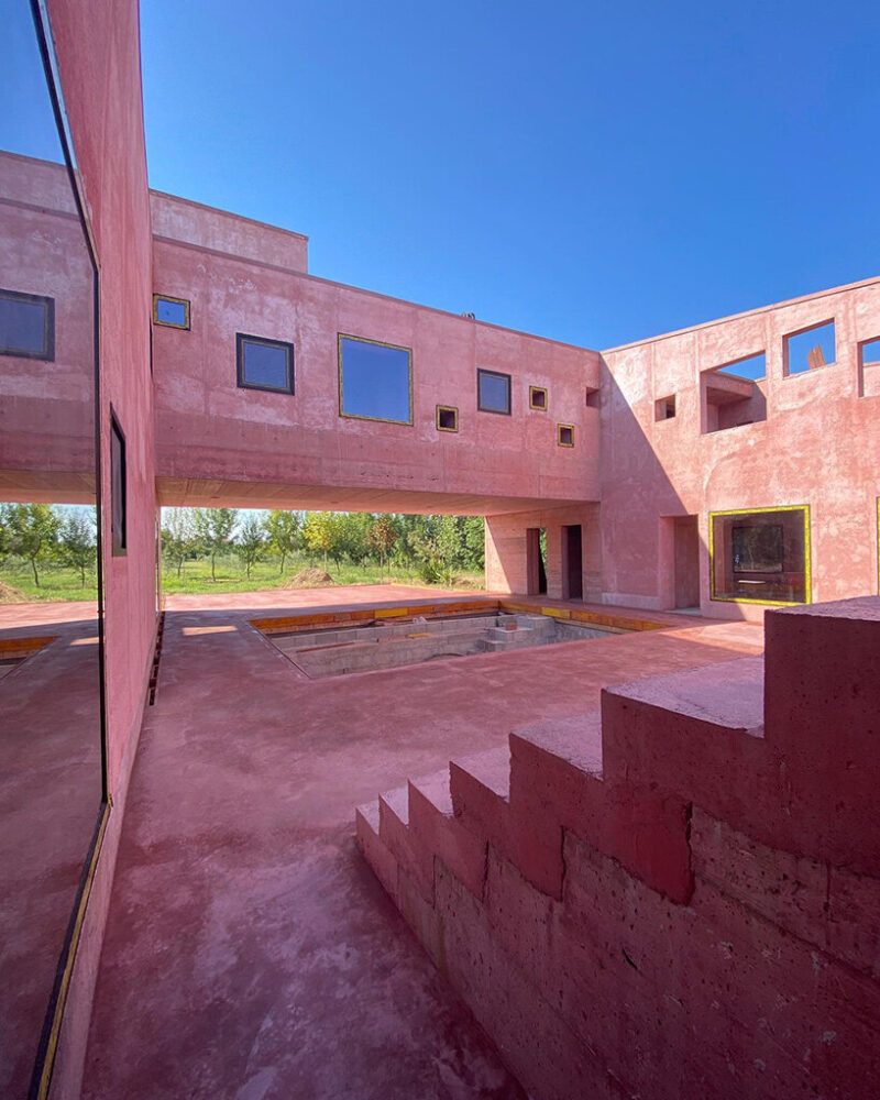 square openings punctuate the inner facades, framing views across the courtyard.