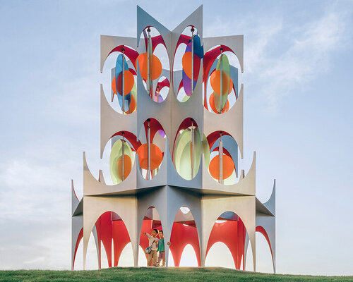 suspended colored discs move through daxing jizi design’s faceted installation in beijing