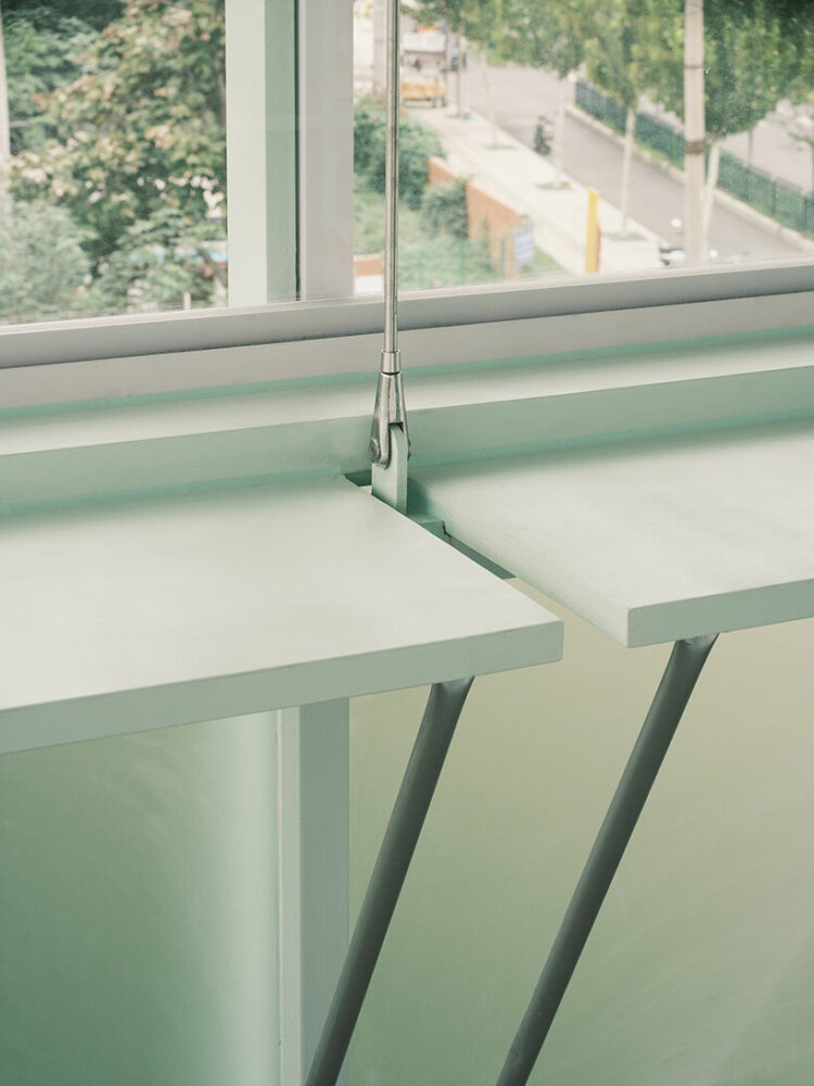 detail of the built-in desks that line the glazed perimeter