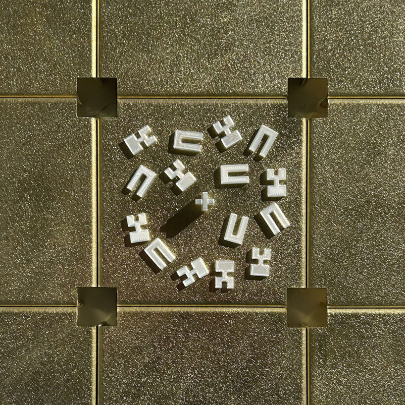 one hundred custom 3D printed joints connect the brass elements